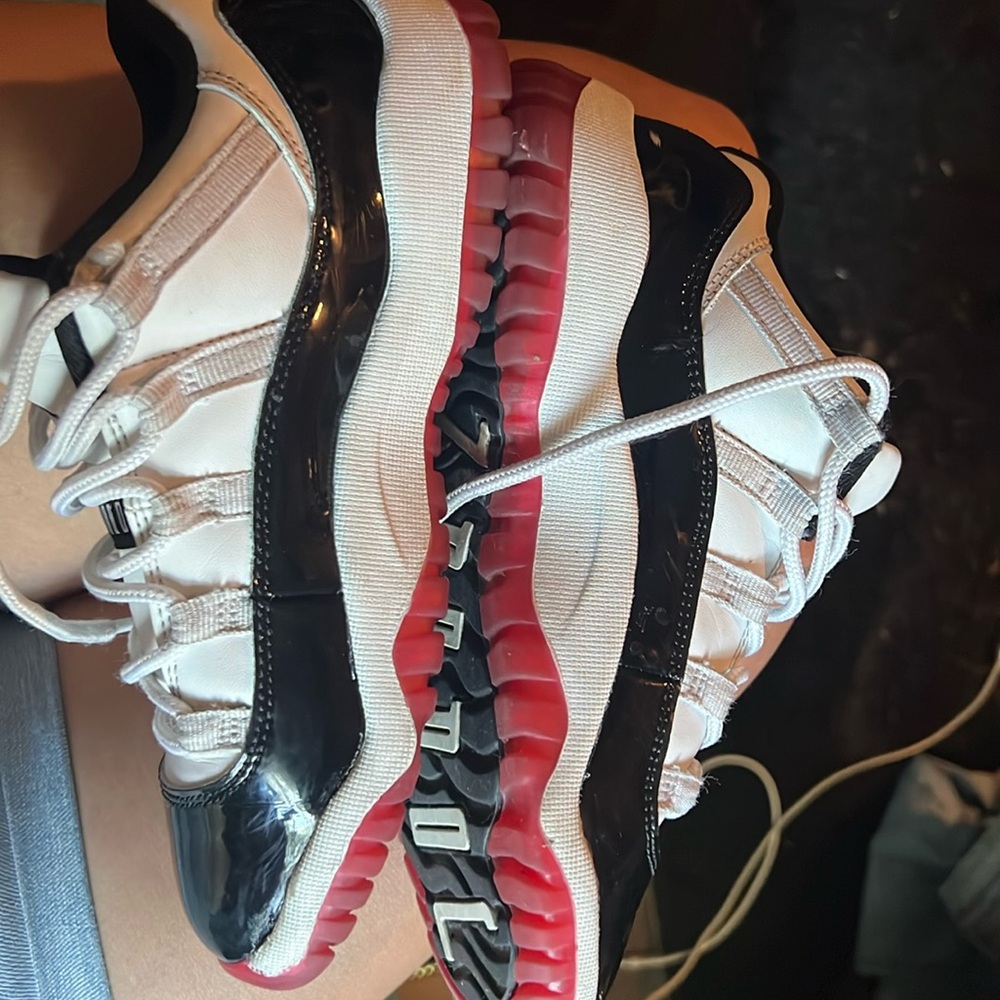 White, black & red Jordan 11’s. Size 2y big kids